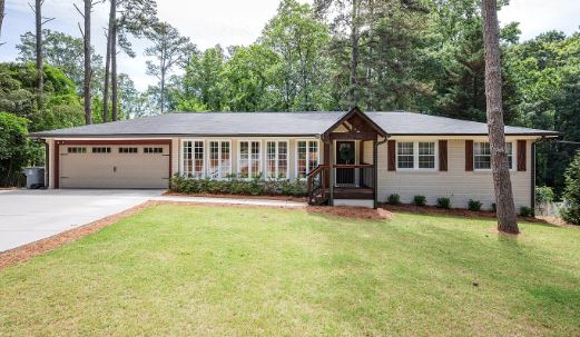 MANAV Capital flagship single-family renovation at Skyland Dr, Roswell, GA — renovated ranch home with landscaped front lawn.